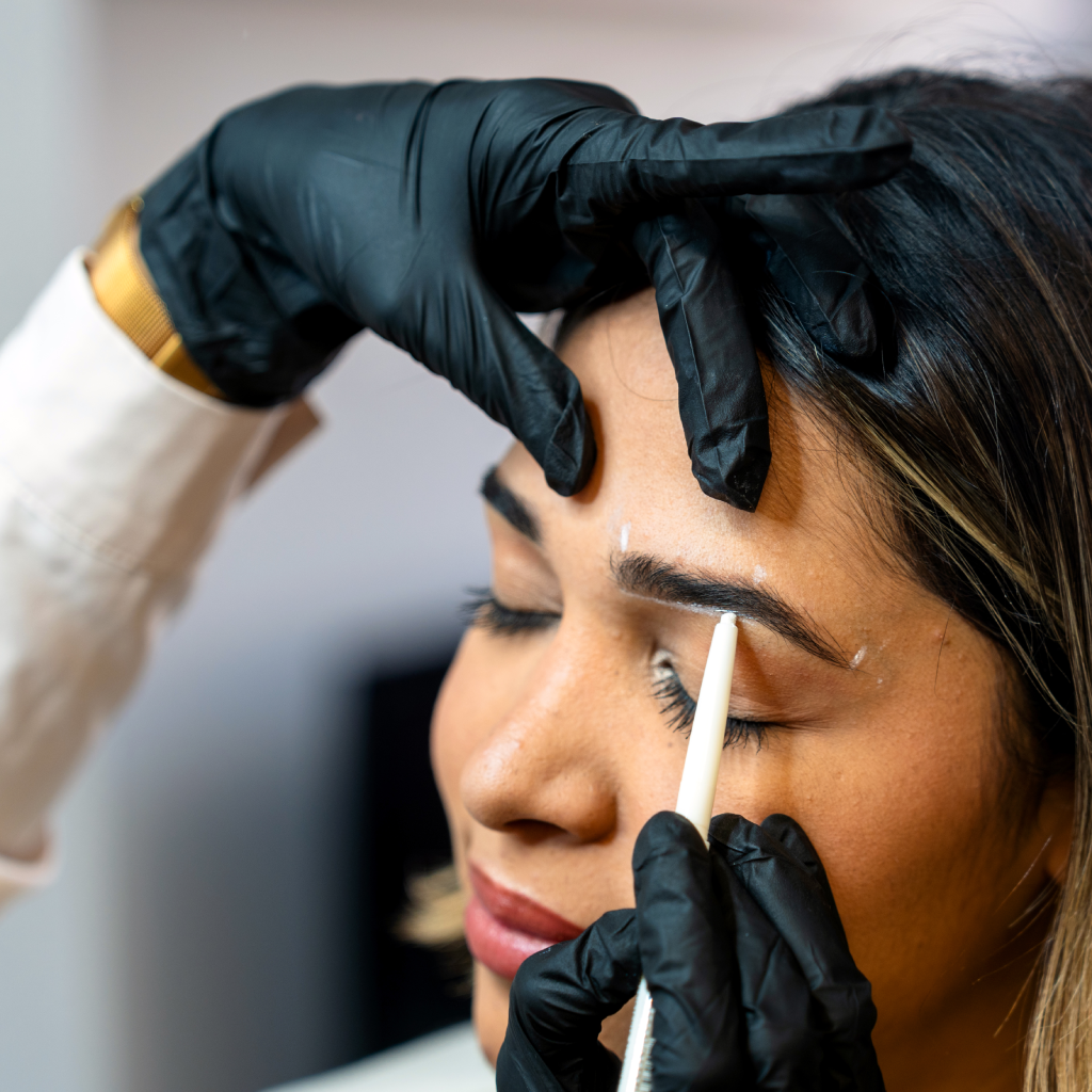 Permanent makeup near me – professional brow mapping and marking before eyebrow tattoo procedure for precise results.