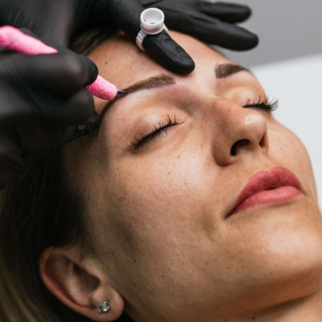 Permanent makeup near me – professional microblading procedure in progress for natural-looking eyebrow enhancement.